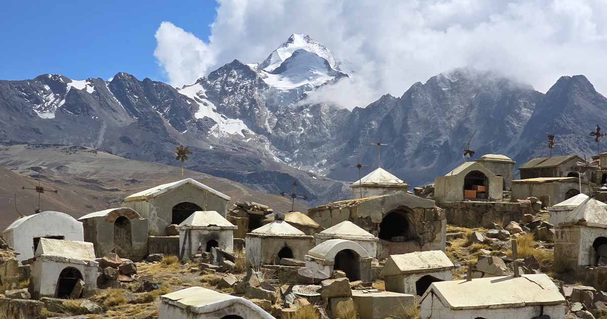 Old graveyard with tombs and crosses, with Huayna Potosí mountain in the background