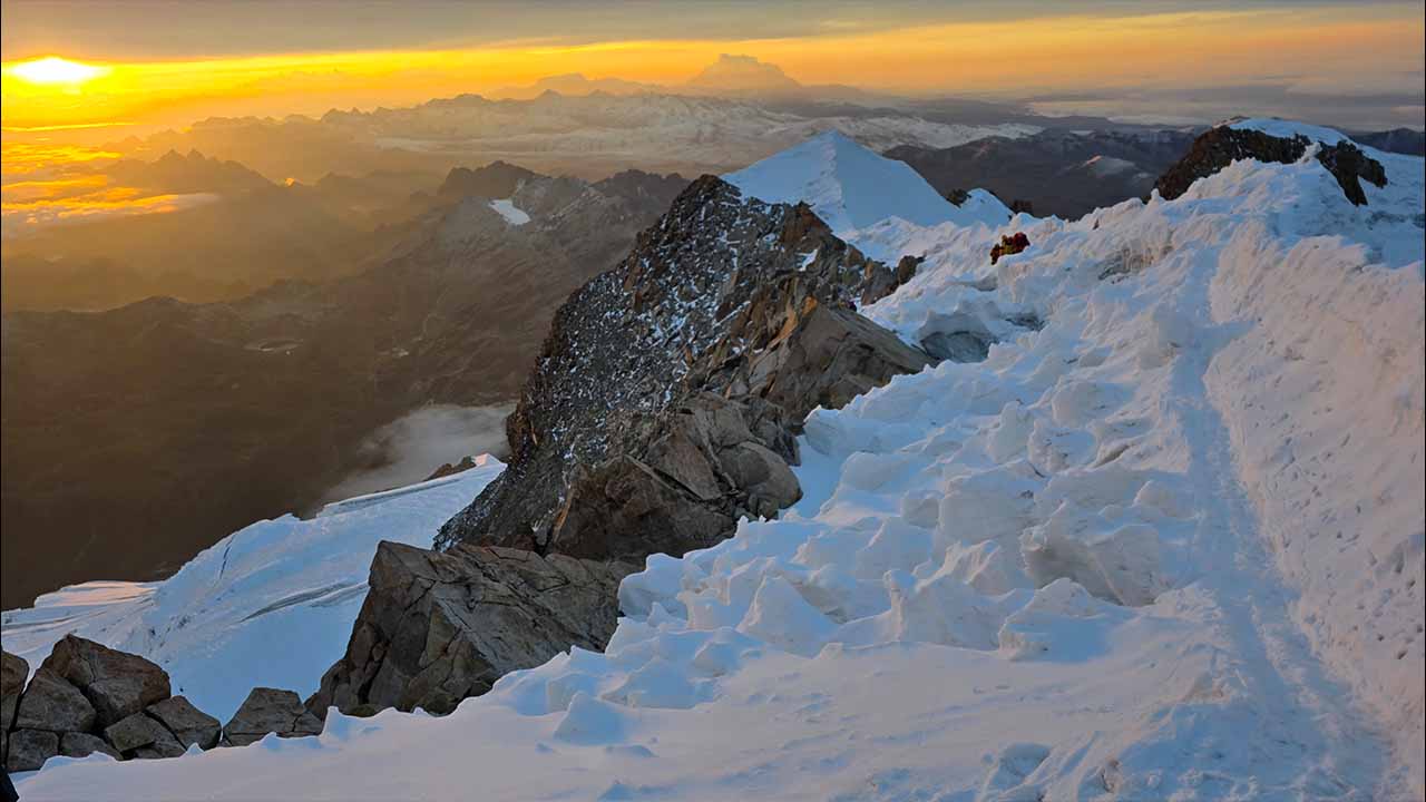 Snow-covered ridge at Huayna Potosí in Bolivia during sunrise