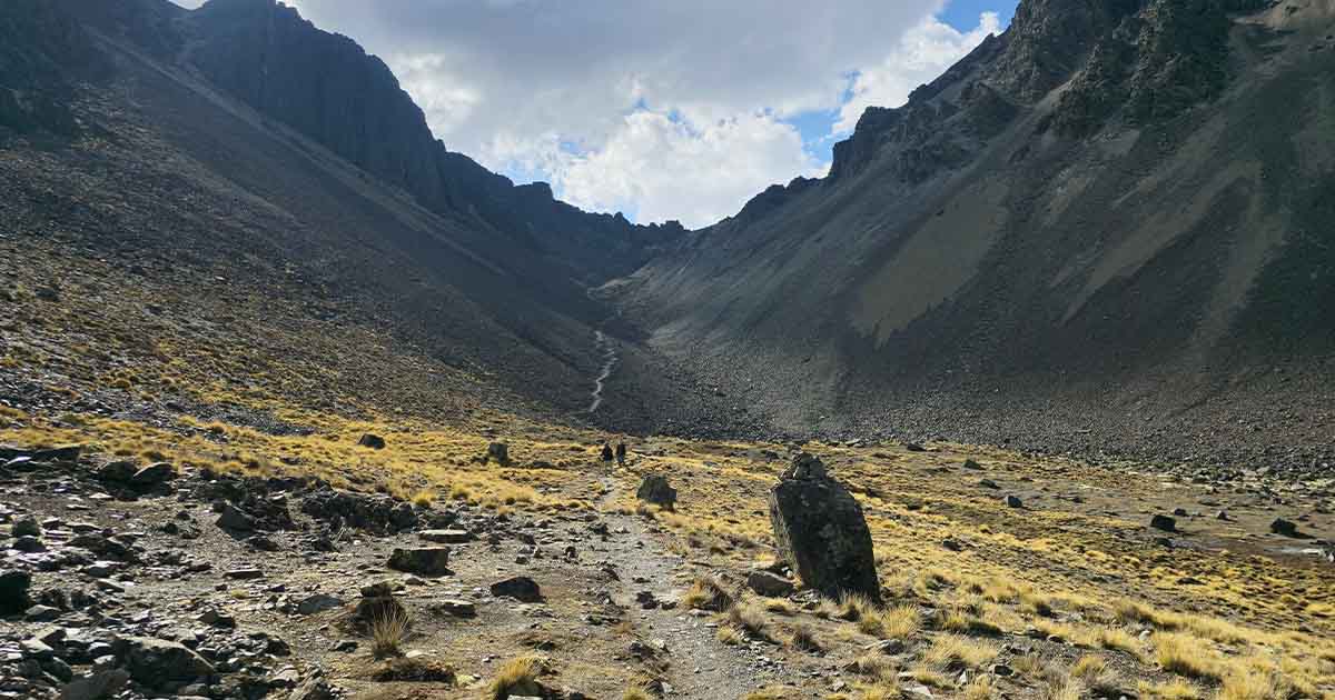 Pathway leading through a rocky valley during the ascent to Pico Austria in Bolivia