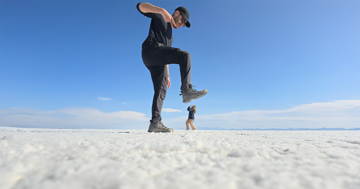 Creative perspective: stepping on a tiny figure in the distance, captured on the salt flats.