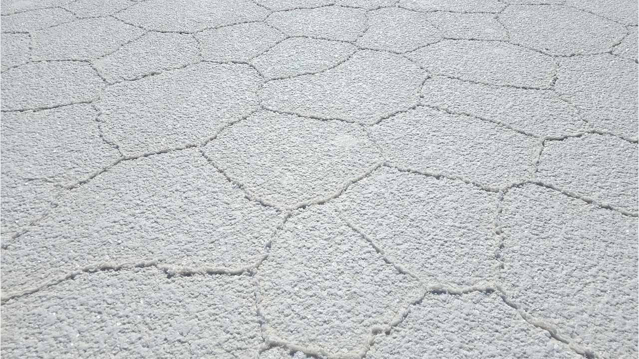 Close-up of the hexagonal salt patterns on the surface of Salar de Uyuni in Bolivia