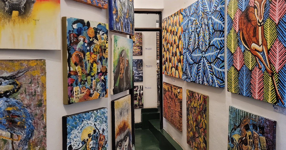 Interior view of an art gallery in Rwanda with various paintings on display