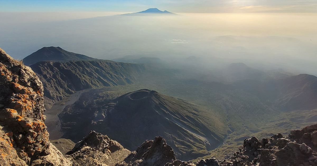 Aerial view of a volcanic crater on Mount Meru at sunrise