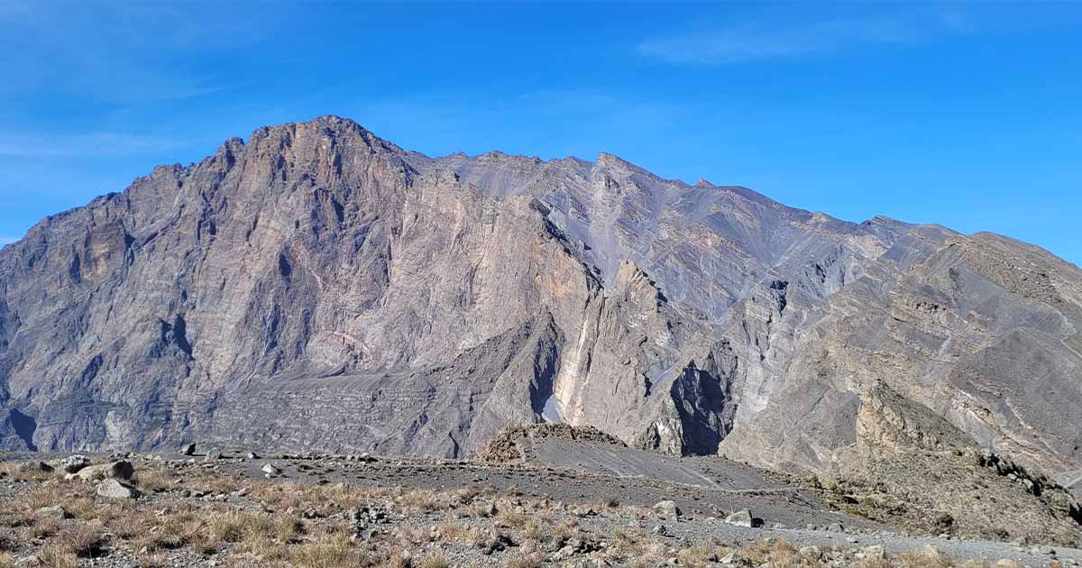 View of Mount Meru's ridge against a clear blue sky